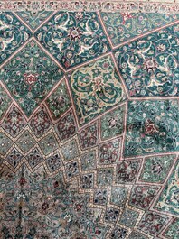 A Persian Tabriz rug with floral design, wool on cotton, first half 20th C.