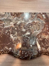 A pair of French carved gilt wooden Louis XV consoles with marble tops, 18th C.