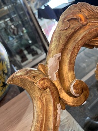 A pair of French carved gilt wooden Louis XV consoles with marble tops, 18th C.