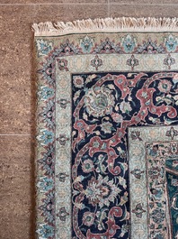 A Persian Tabriz rug with floral design, wool on cotton, first half 20th C.