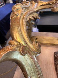 A pair of French carved gilt wooden Louis XV consoles with marble tops, 18th C.