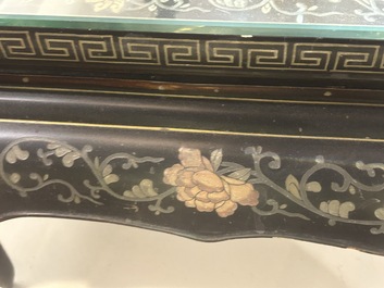 A Chinese rectangular lacquered wooden table with three cloisonn&eacute; plaques, 20th C.