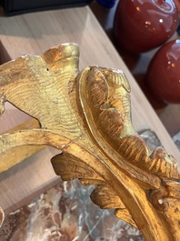 A pair of French carved gilt wooden Louis XV consoles with marble tops, 18th C.