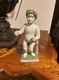A polychrome Brussels faience allegorical sculpture depicting one of the four seasons, 19th C.