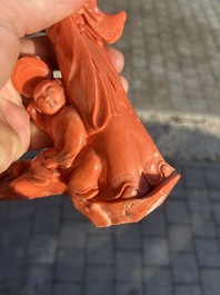 A Chinese red coral group with a scholar, his servant and a monkey, two-character mark, 19th C.