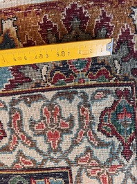 A Persian Tabriz rug with floral design, wool on cotton, first half 20th C.