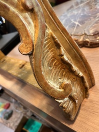 A pair of French carved gilt wooden Louis XV consoles with marble tops, 18th C.