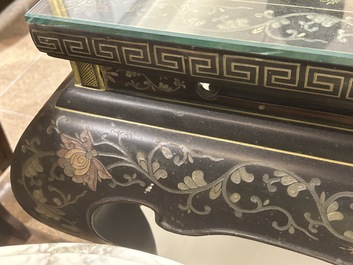 A Chinese rectangular lacquered wooden table with three cloisonn&eacute; plaques, 20th C.