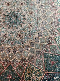 A Persian Tabriz rug with floral design, wool on cotton, first half 20th C.