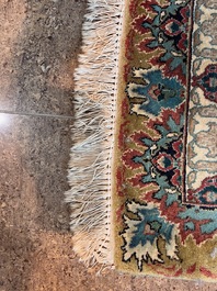 A Persian Tabriz rug with floral design, wool on cotton, first half 20th C.