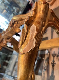 A pair of French carved gilt wooden Louis XV consoles with marble tops, 18th C.