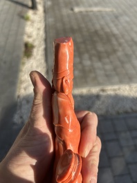 A Chinese red coral group with a scholar, his servant and a monkey, two-character mark, 19th C.