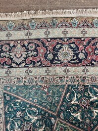 A Persian Tabriz rug with floral design, wool on cotton, first half 20th C.