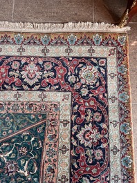 A Persian Tabriz rug with floral design, wool on cotton, first half 20th C.