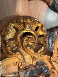 A pair of French carved gilt wooden Louis XV consoles with marble tops, 18th C.