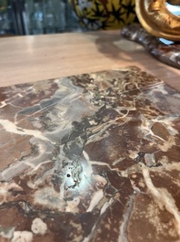 A pair of French carved gilt wooden Louis XV consoles with marble tops, 18th C.