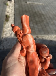 A Chinese red coral group with a scholar, his servant and a monkey, two-character mark, 19th C.