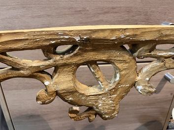 A pair of French carved gilt wooden Louis XV consoles with marble tops, 18th C.