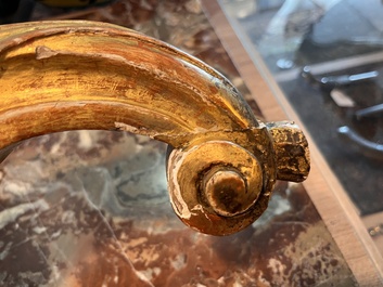 A pair of French carved gilt wooden Louis XV consoles with marble tops, 18th C.