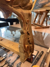 A pair of French carved gilt wooden Louis XV consoles with marble tops, 18th C.