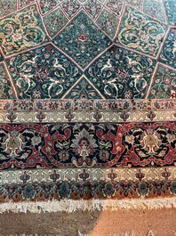 A Persian Tabriz rug with floral design, wool on cotton, first half 20th C.