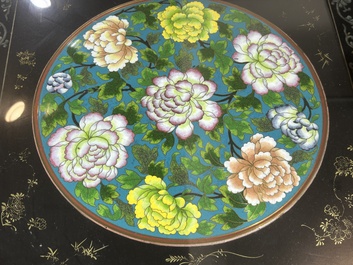 A Chinese rectangular lacquered wooden table with three cloisonn&eacute; plaques, 20th C.