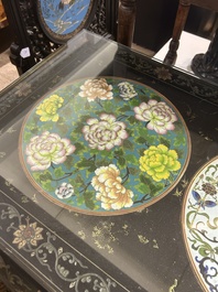 A Chinese rectangular lacquered wooden table with three cloisonn&eacute; plaques, 20th C.