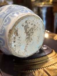 A twisted blue and white Dutch Delft chinoiserie jug, 17th C.