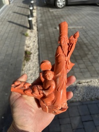 A Chinese red coral group with a scholar, his servant and a monkey, two-character mark, 19th C.