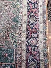 A Persian Tabriz rug with floral design, wool on cotton, first half 20th C.