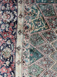 A Persian Tabriz rug with floral design, wool on cotton, first half 20th C.