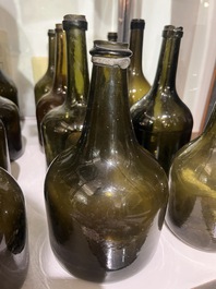 Sixteen Dutch and Flemish green glass wine bottles, 17th/19th C.