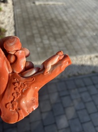 A Chinese red coral group with a scholar, his servant and a monkey, two-character mark, 19th C.