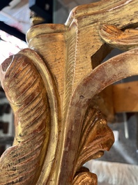 A pair of French carved gilt wooden Louis XV consoles with marble tops, 18th C.