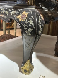 A Chinese rectangular lacquered wooden table with three cloisonn&eacute; plaques, 20th C.