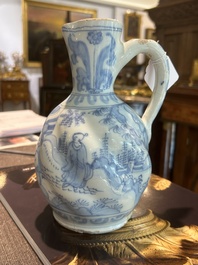 A twisted blue and white Dutch Delft chinoiserie jug, 17th C.