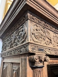 A Dutch elaborate carved oak Renaissance four-door cupboard, 17th C.