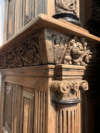 A Dutch elaborate carved oak Renaissance four-door cupboard, 17th C.