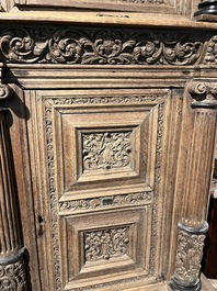 A Dutch elaborate carved oak Renaissance four-door cupboard, 17th C.
