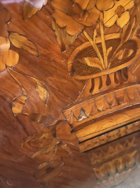 A pair of French Louis XVI style single door hall cabinets with floral marquetry, gilt bronze mounts and marble tops, 19th C.