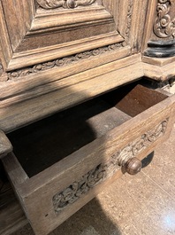 A Dutch elaborate carved oak Renaissance four-door cupboard, 17th C.