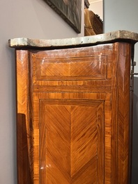 A pair of French Louis XVI style single door hall cabinets with floral marquetry, gilt bronze mounts and marble tops, 19th C.