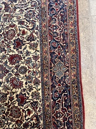 A Persian Isfahan rug with floral design, wool on silk, first half 20th C.