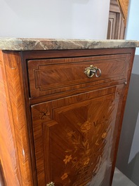 A pair of French Louis XVI style single door hall cabinets with floral marquetry, gilt bronze mounts and marble tops, 19th C.