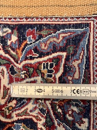 A Persian Isfahan rug with floral design, wool on silk, first half 20th C.