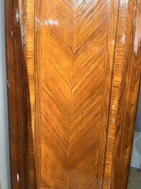 A pair of French Louis XVI style single door hall cabinets with floral marquetry, gilt bronze mounts and marble tops, 19th C.