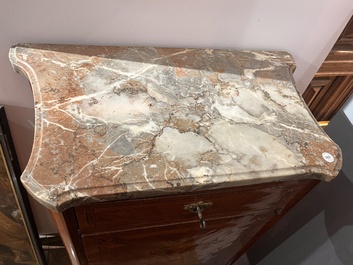 A pair of French Louis XVI style single door hall cabinets with floral marquetry, gilt bronze mounts and marble tops, 19th C.