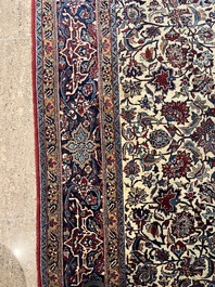 A Persian Isfahan rug with floral design, wool on silk, first half 20th C.
