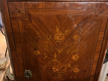 A pair of French Louis XVI style single door hall cabinets with floral marquetry, gilt bronze mounts and marble tops, 19th C.
