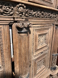 A Dutch elaborate carved oak Renaissance four-door cupboard, 17th C.